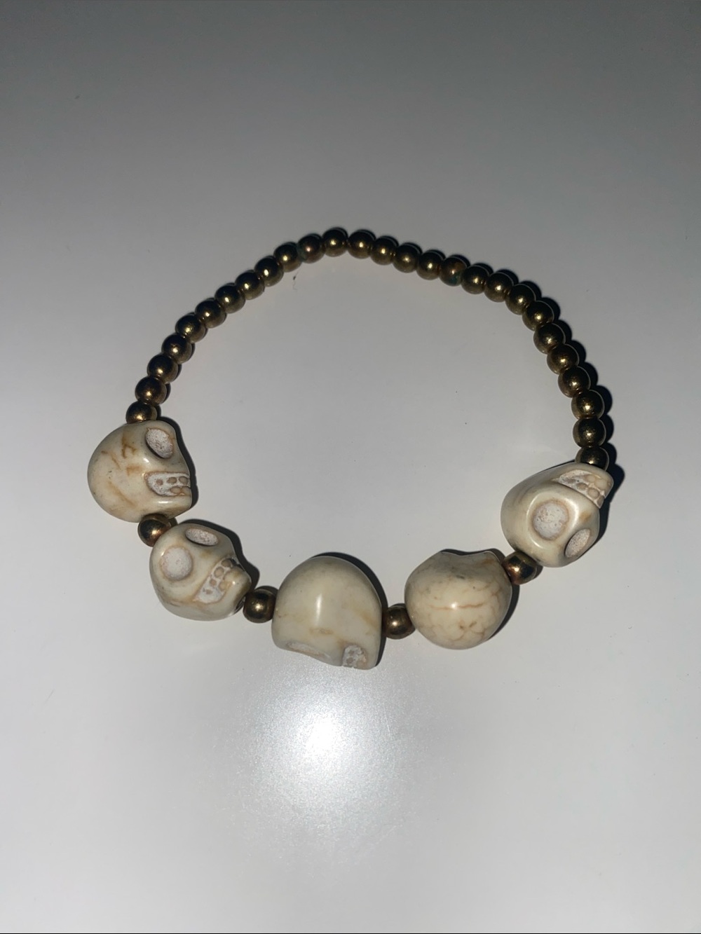 Beaded Skull Stretch Bracelet in Cream and Antique Gold